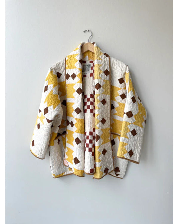 The Parenting 2025 Parker Posey Yellow & White Quilted Coat