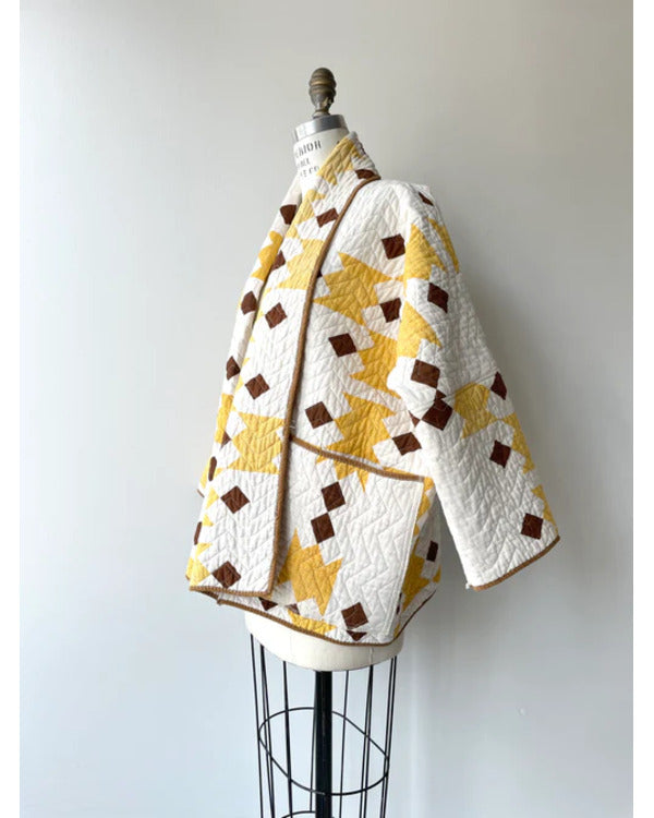 The Parenting 2025 Parker Posey Yellow & White Quilted Coat