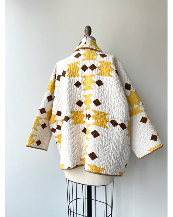 The Parenting 2025 Parker Posey Yellow & White Quilted Coat