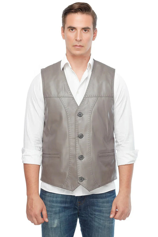 Man wearing a gray vest over a white shirt on a white background