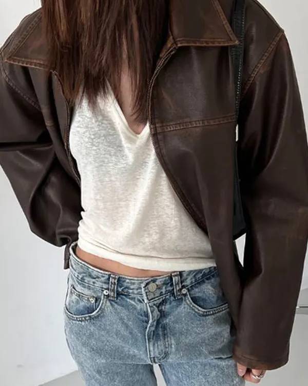 Men’s black leather jacket featuring sleek design and quilted shoulders