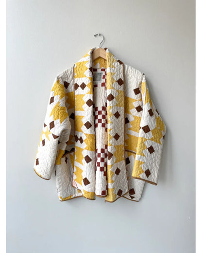The Parenting 2025 Parker Posey Yellow & White Quilted Coat